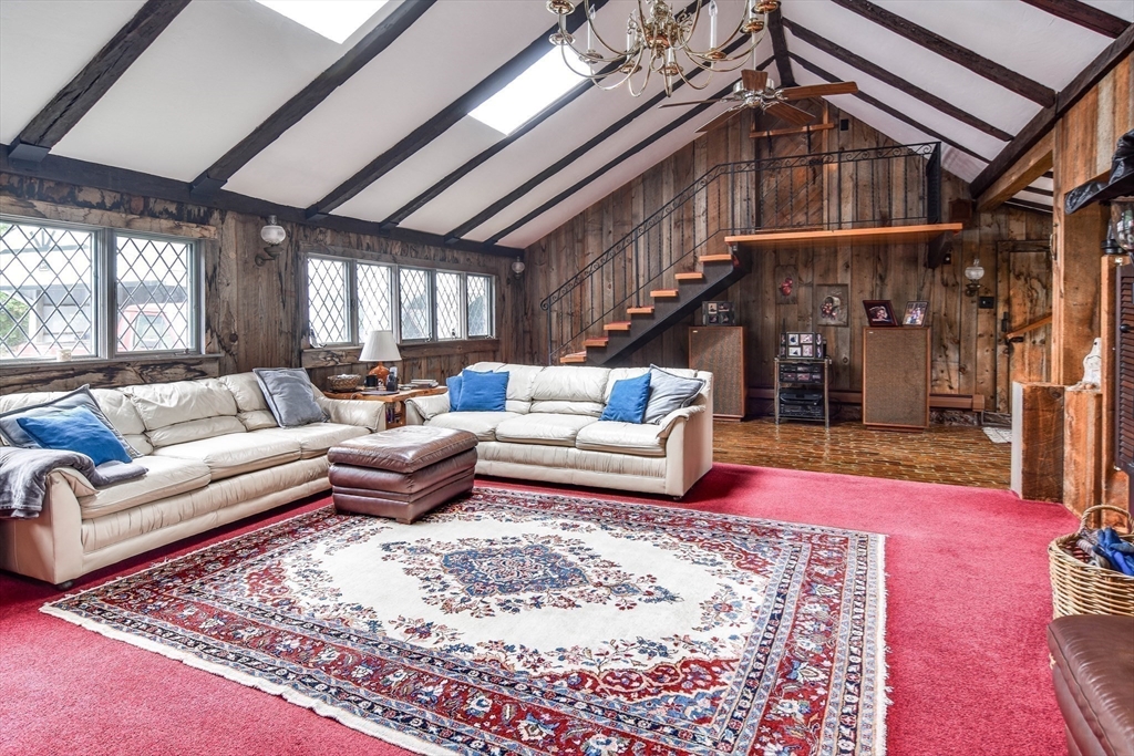192 West Main Street Westborough, MA 01581 - Photo 15 of 42 a living room with furniture a rug and a chandelier