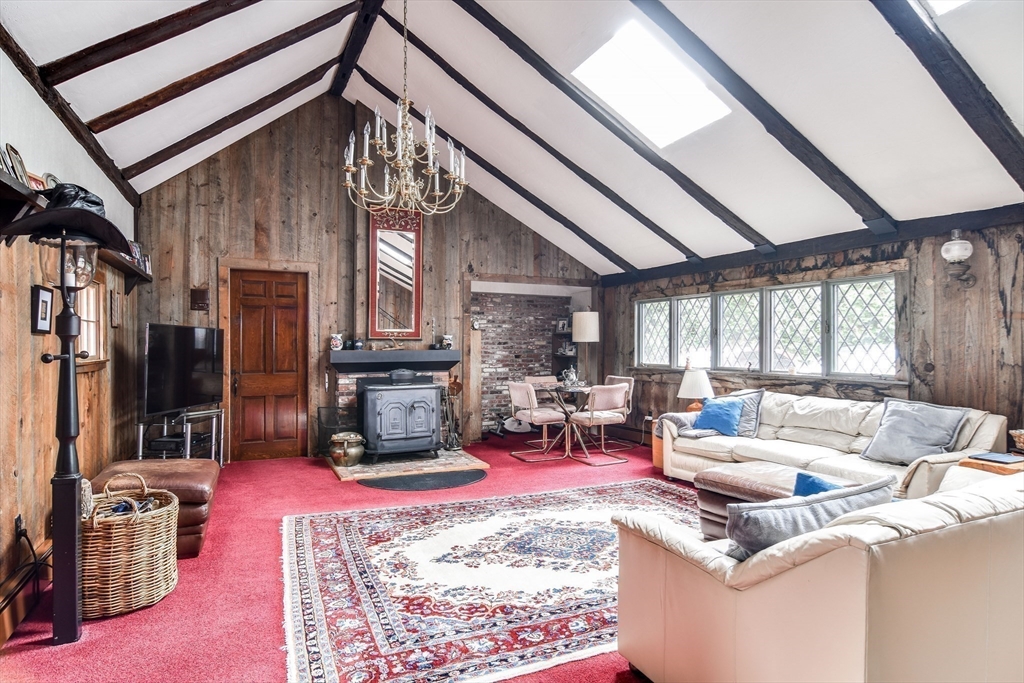 192 West Main Street Westborough, MA 01581 - Photo 16 of 42 a living room with furniture fireplace and a large window