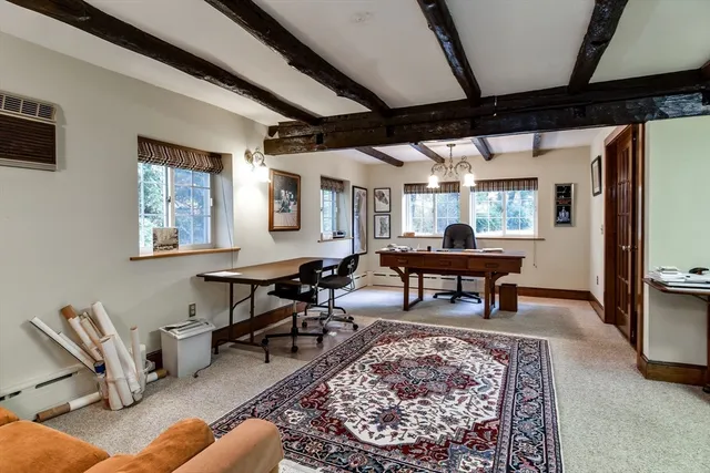 a bedroom with a large bed and a tv