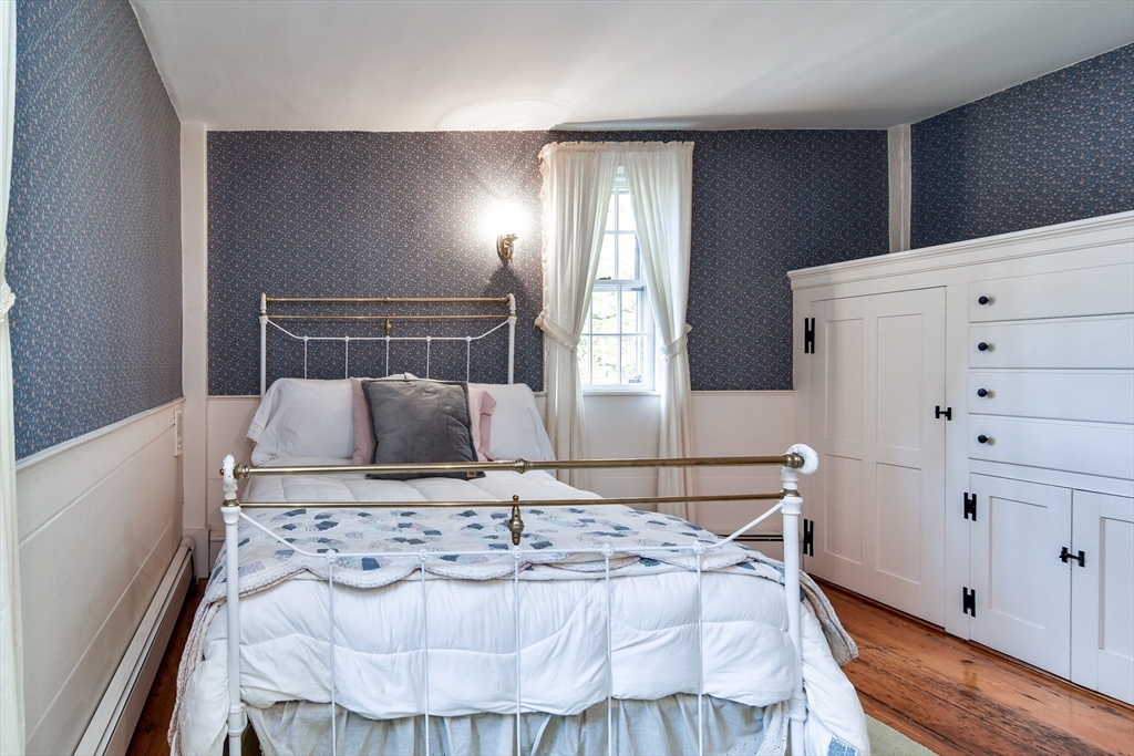 192 West Main Street Westborough, MA 01581 - Photo 22 of 42 a view of a kitchen with furniture and wooden floor