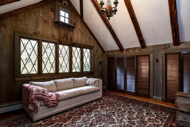 a kitchen with granite countertop a sink and a chair