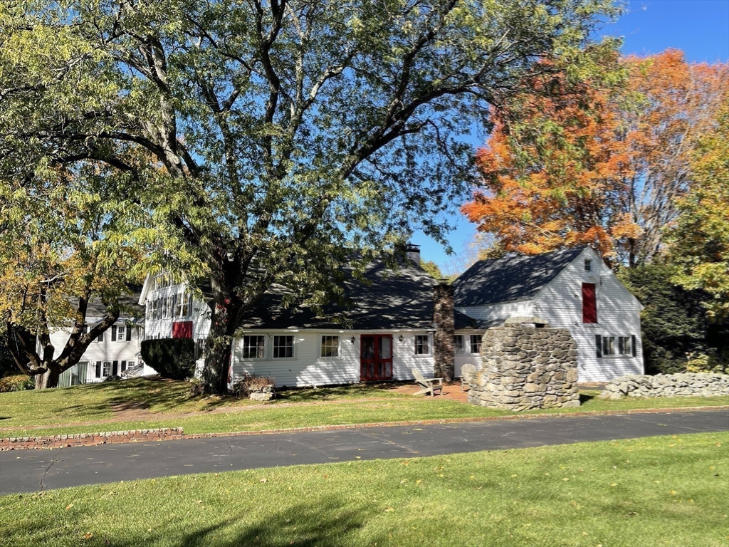 192 West Main Street Westborough, MA 01581 - Photo 27 of 42 a front view of a house with a yard and a garden
