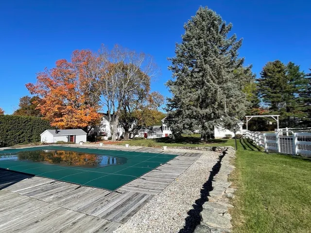 a view of swimming pool with seating area