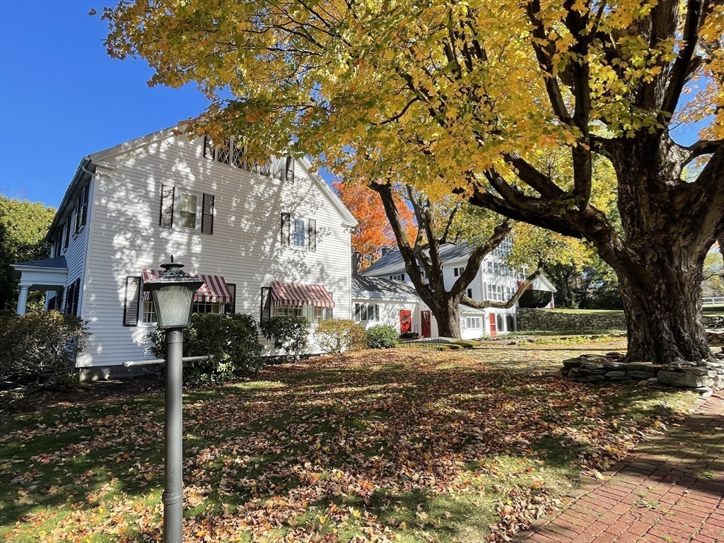 192 West Main Street Westborough, MA 01581 - Photo 4 of 42 a view of a yard with plants and a large tree