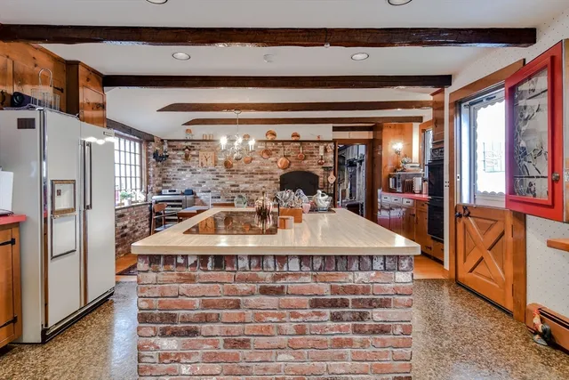 a living room with furniture a window and a table