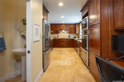 a view of a kitchen with a refrigerator
