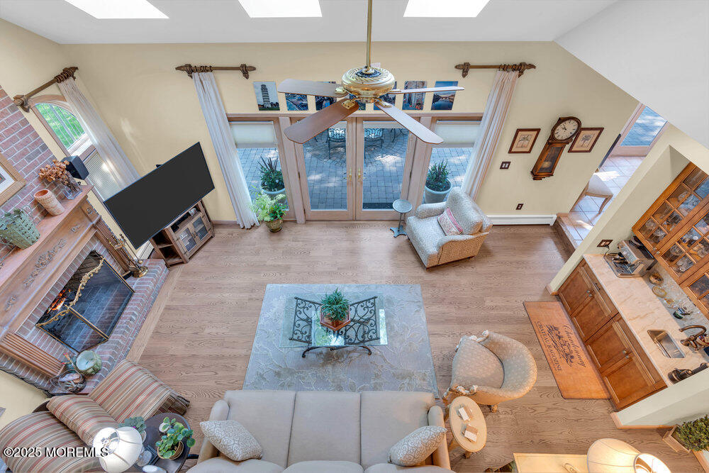 203 Stone Hill Road Freehold, NJ 07728 - Photo 33 of 83 a living room with furniture fireplace and a flat screen tv