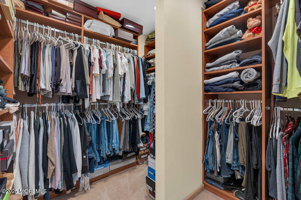 203 Stone Hill Road Freehold, NJ 07728 - Photo 51 of 83 a view of walk in closet with clothes