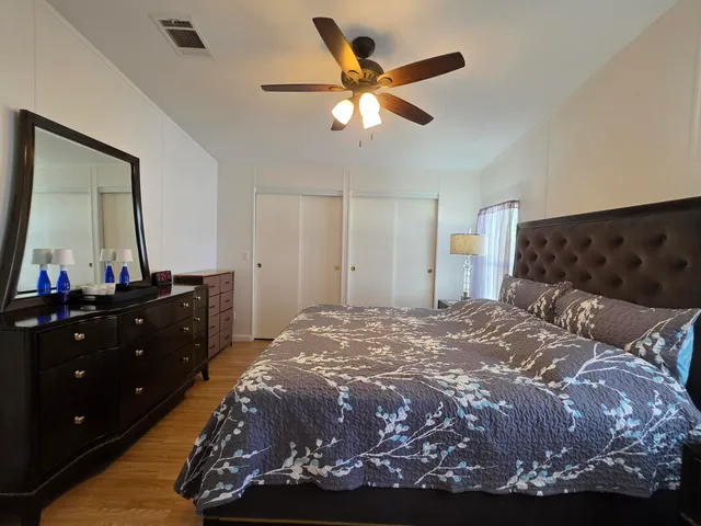 a bathroom with a toilet a sink and a window