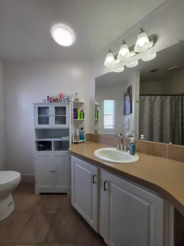 a bathroom with a toilet and a sink
