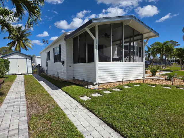 a view of house with yard