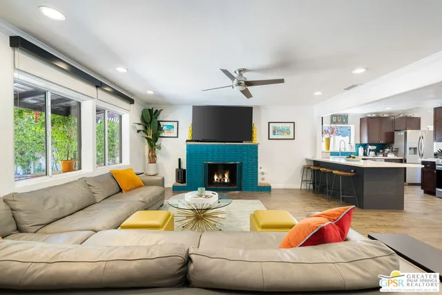 a living room with furniture and a fireplace