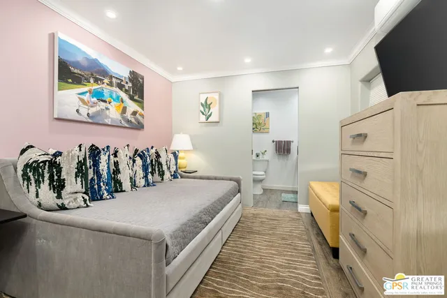 a bedroom with a bed and a view of bathroom