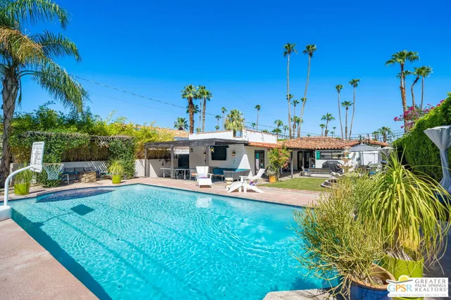 a view of a swimming pool with a patio