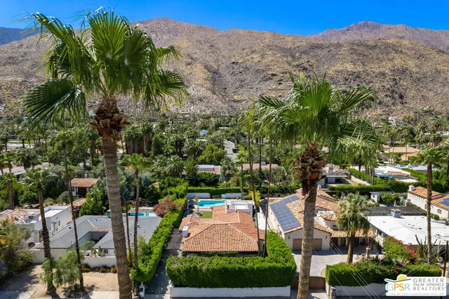 a view of multiple houses with a yard