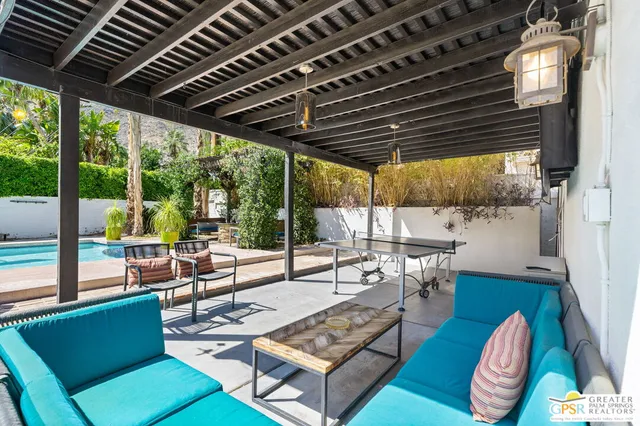 a outdoor space with patio lots of furniture and large windows