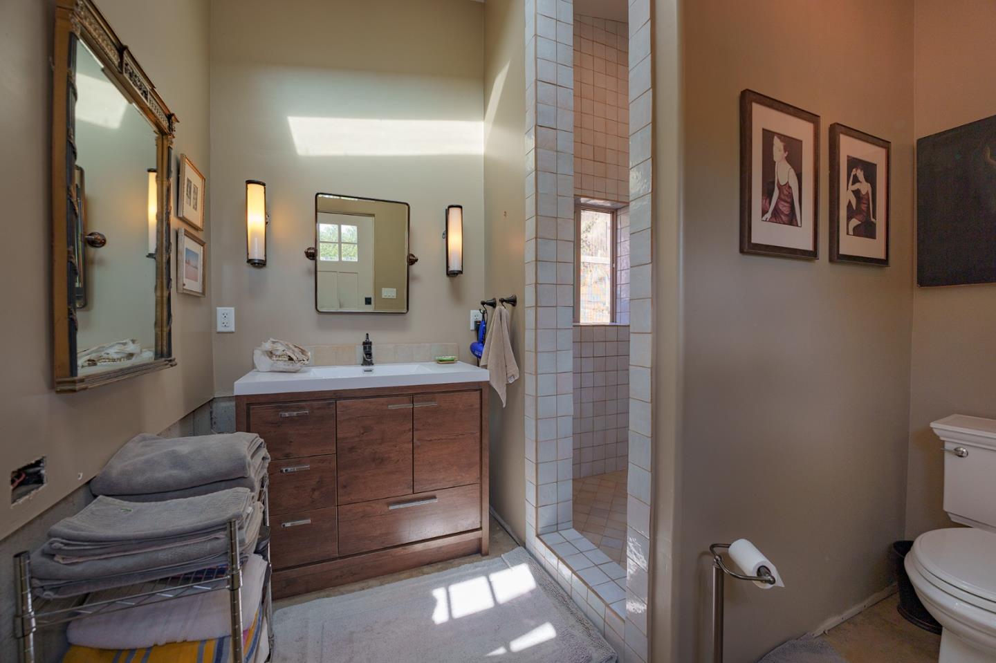 0 River Road Salinas, CA 93908 - Photo 29 of 35 a spacious bathroom with a toilet sink and mirror