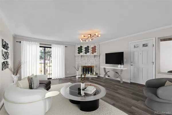 a living room with furniture a fireplace and a flat screen tv