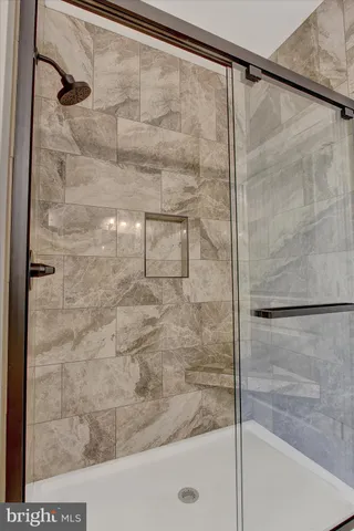 a bathroom with double vanity sink and a mirror