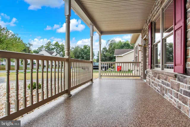 a view of porch with a swing