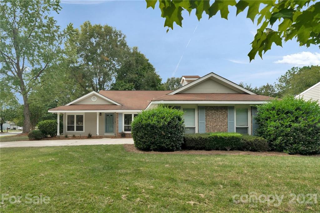 9838 Fairway Ridge Road, Unit 11 Charlotte, NC 28277 - Photo 1 of 40 a front view of a house with a garden