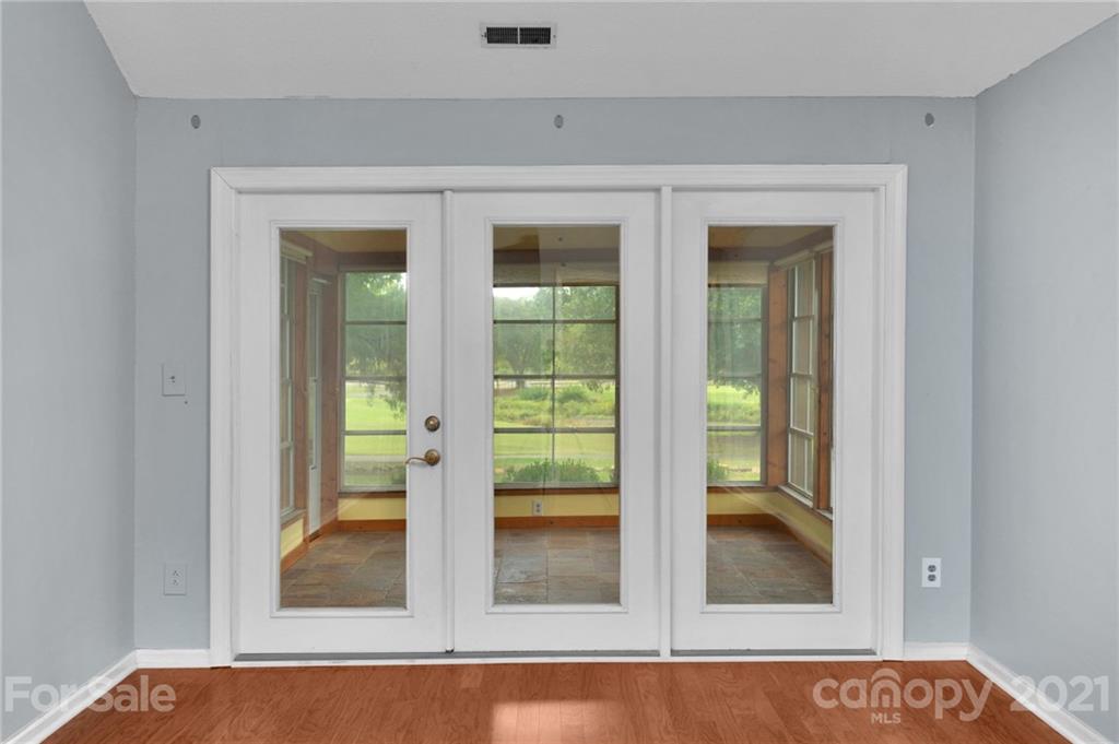 9838 Fairway Ridge Road, Unit 11 Charlotte, NC 28277 - Photo 22 of 40 a view of a hallway with a glass door