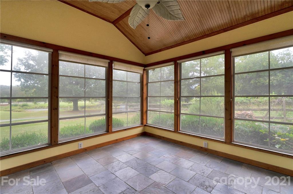 9838 Fairway Ridge Road, Unit 11 Charlotte, NC 28277 - Photo 30 of 40 a view of an empty room with windows