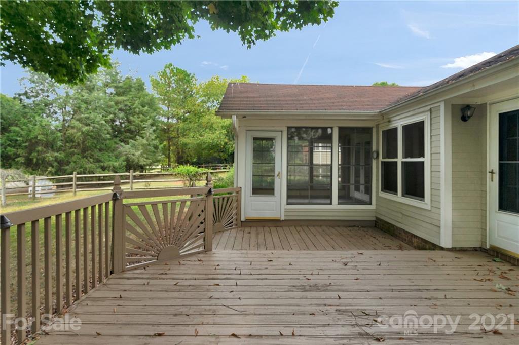 9838 Fairway Ridge Road, Unit 11 Charlotte, NC 28277 - Photo 34 of 40 a balcony with wooden floor and fence