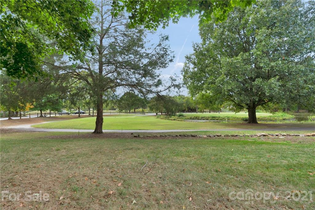 9838 Fairway Ridge Road, Unit 11 Charlotte, NC 28277 - Photo 35 of 40 a view of a house with a yard
