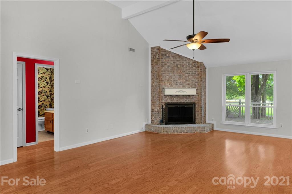 9838 Fairway Ridge Road, Unit 11 Charlotte, NC 28277 - Photo 10 of 40 a view of a livingroom with a fireplace and window