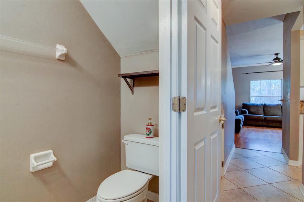 4933 Northwest 1st Place, Unit 110 Gainesville, FL 32607 - Photo 11 of 31 a bathroom with a toilet and a shower