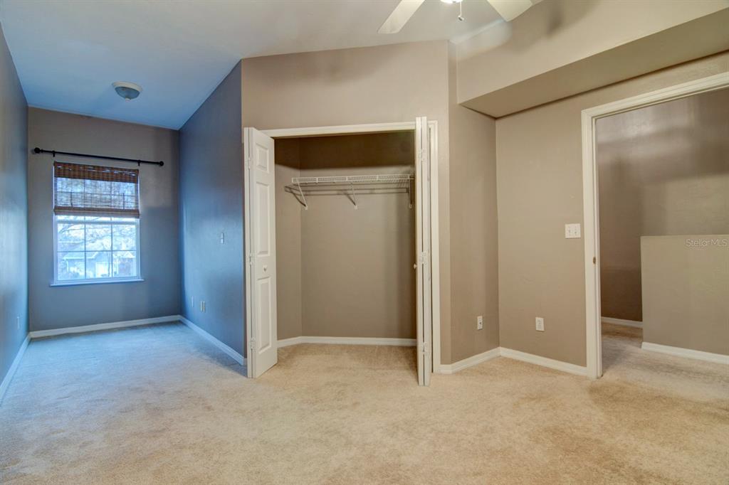 4933 Northwest 1st Place, Unit 110 Gainesville, FL 32607 - Photo 17 of 31 a view of an empty room with closet and a window