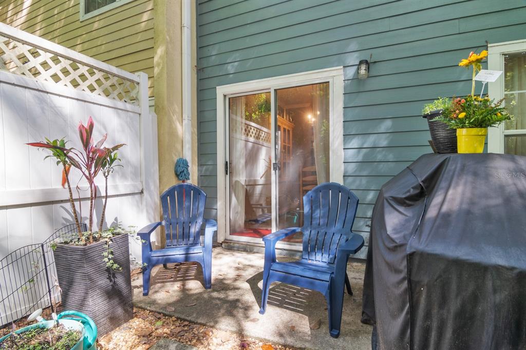 4933 Northwest 1st Place, Unit 110 Gainesville, FL 32607 - Photo 26 of 31 a front view of a house with outdoor seating