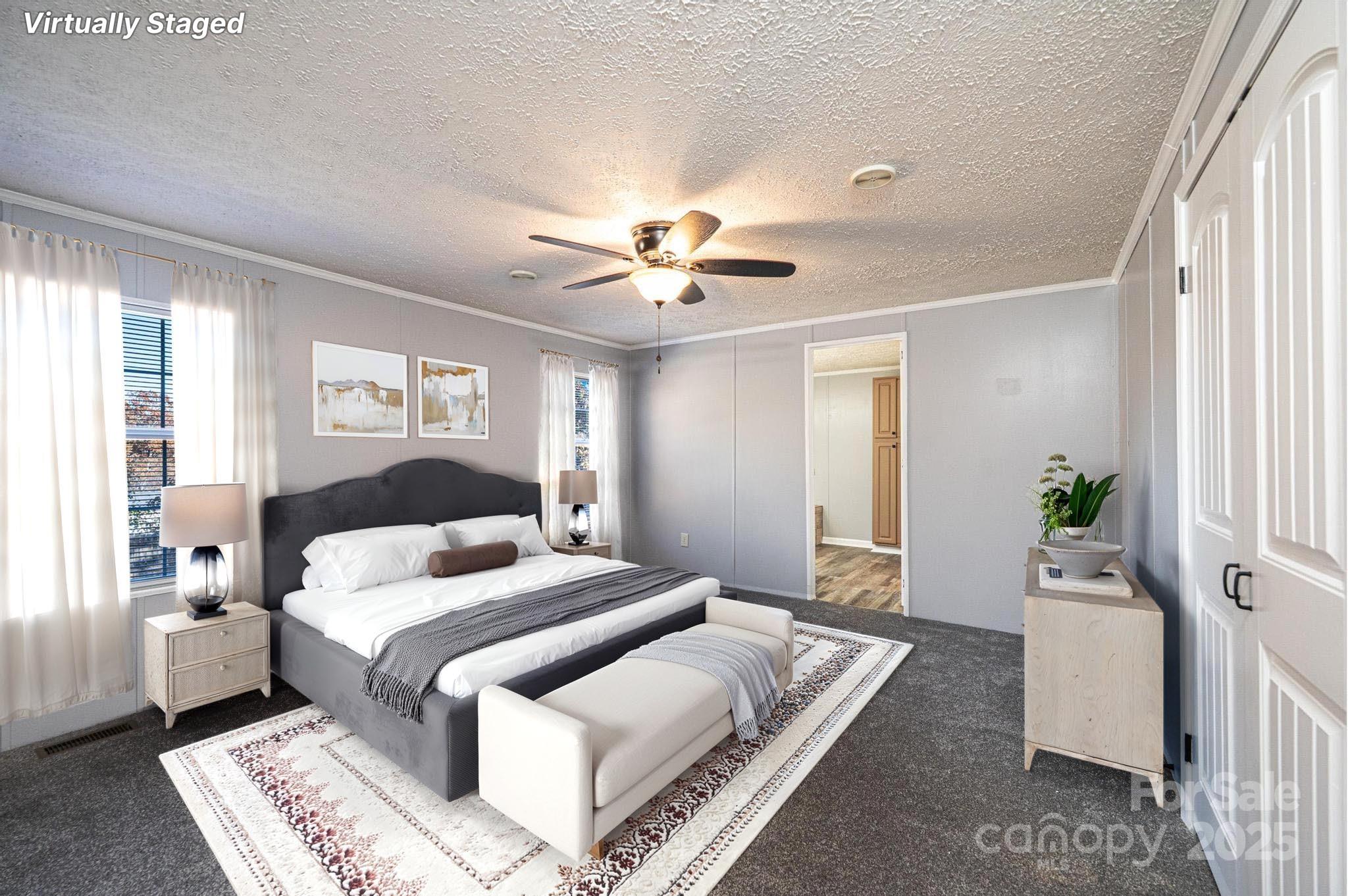 4086 Beckys Drive Lenoir, NC 28645 - Photo 11 of 23 a bedroom with bed and a chandelier