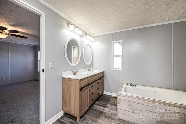 a view of a house with backyard and a tree