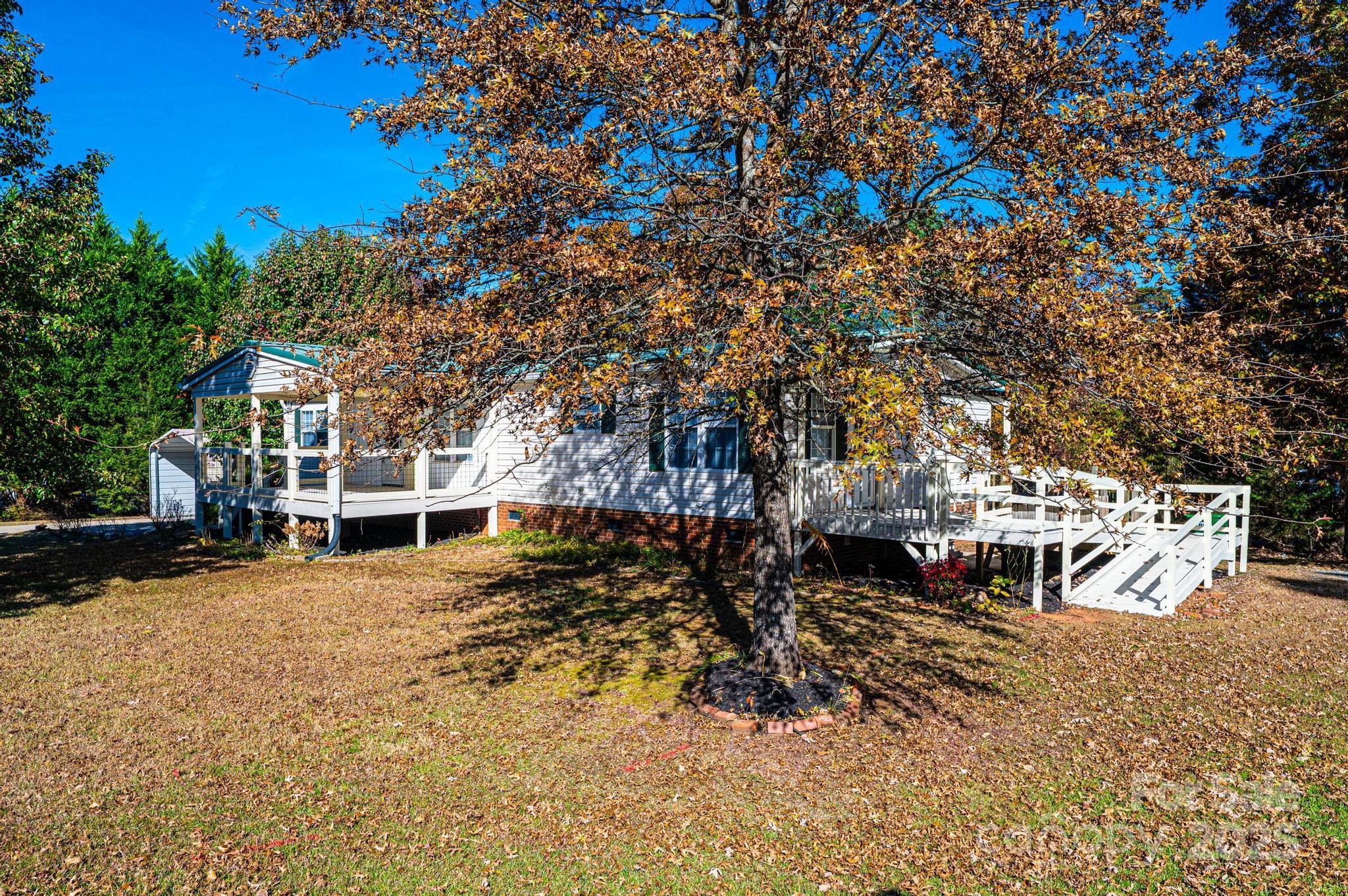 4086 Beckys Drive Lenoir, NC 28645 - Photo 20 of 23 a view of a yard with wooden fence
