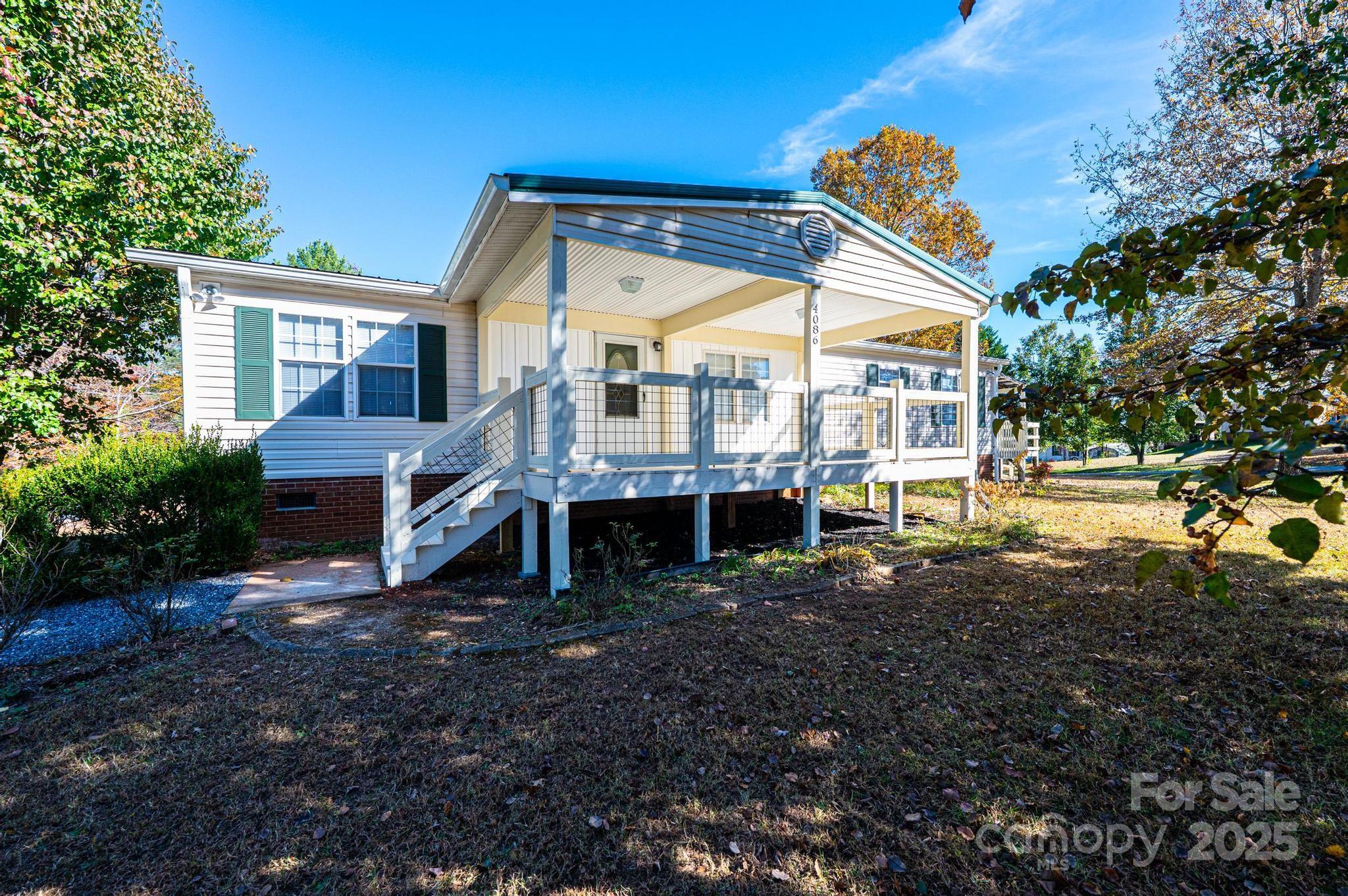 4086 Beckys Drive Lenoir, NC 28645 - Photo 21 of 23 a view of a house with backyard and a tree