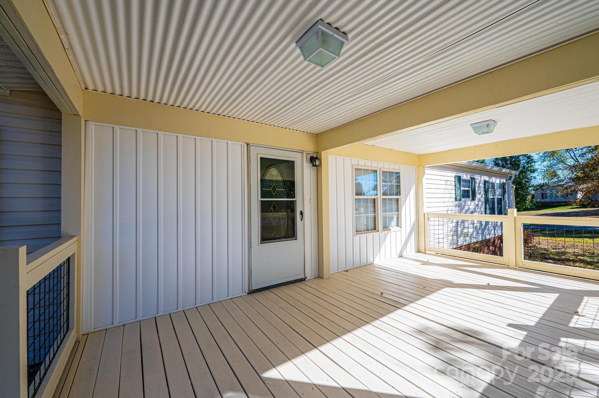 4086 Beckys Drive Lenoir, NC 28645 - Photo 4 of 23 a spacious bathroom with a large window and wooden floor