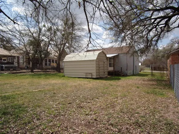 a house view with a backyard space