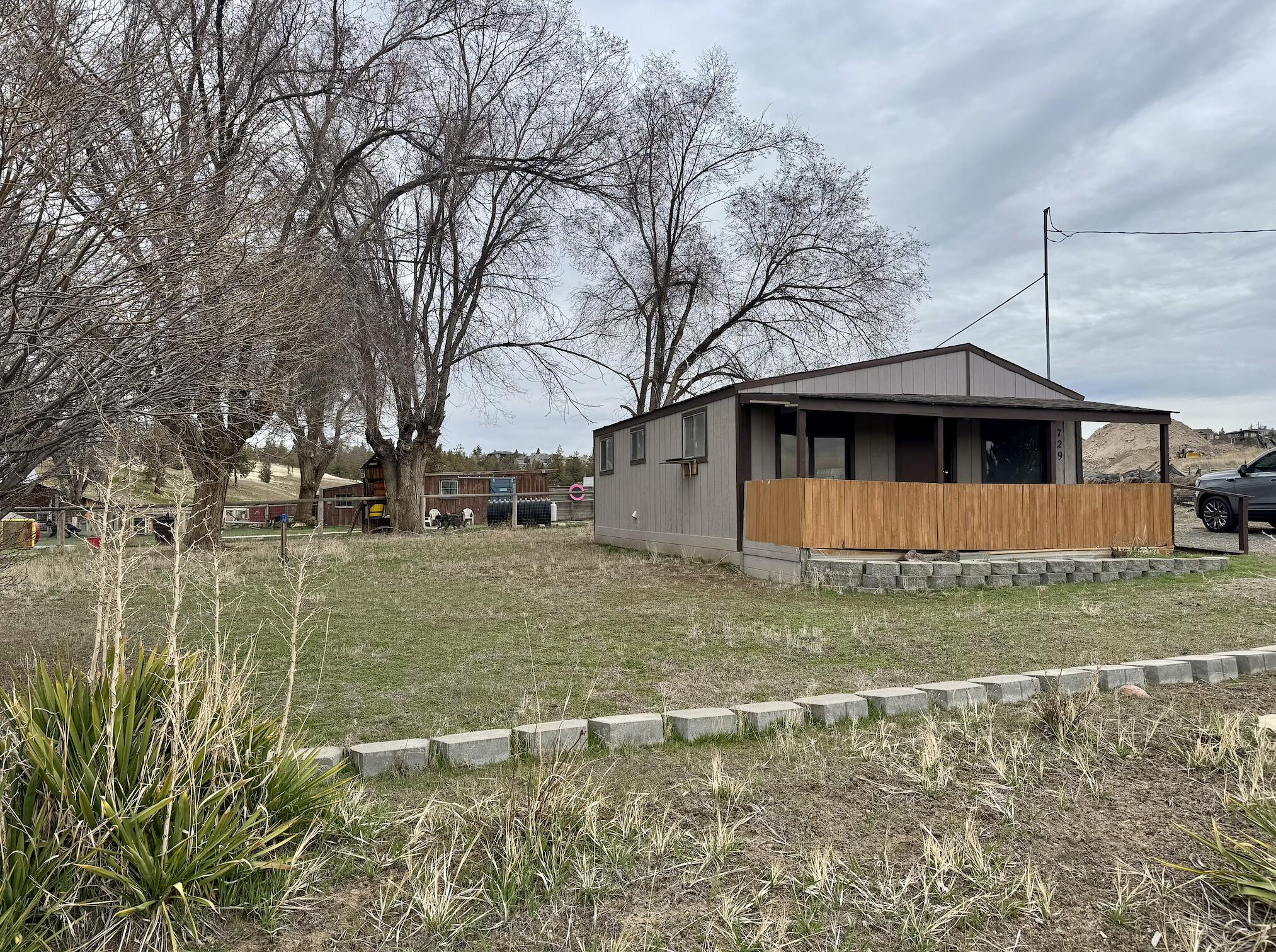 729 Southeast Grizzly Road Madras, OR 97741 - Photo 1 of 14 a view of a house with a yard