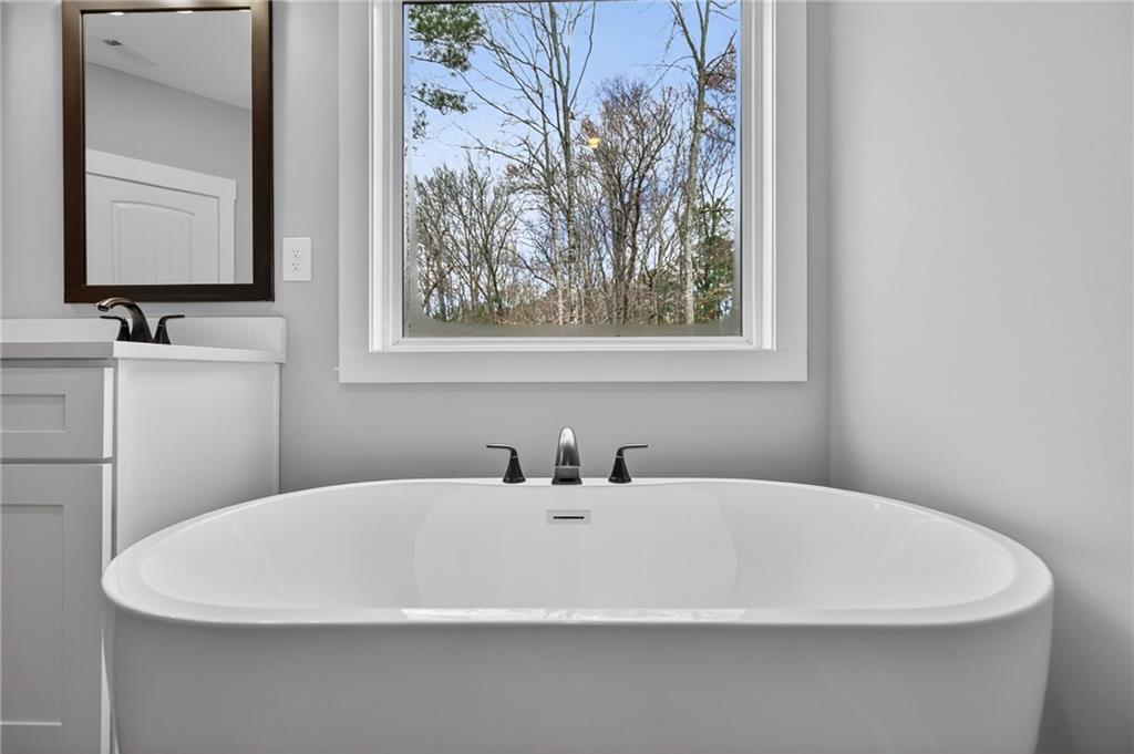 423 Relay Road Silver Creek, GA 30173 - Photo 30 of 48 a white sink with a mirror