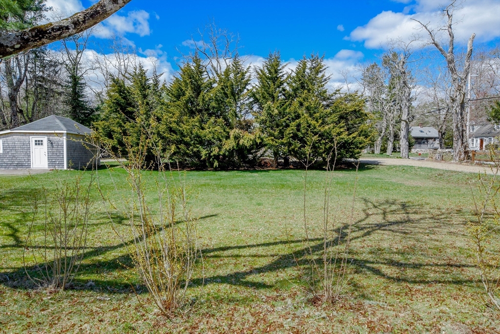 586 B Front Street Marion, MA 02738 - Photo 1 of 10 a view of yard with swimming pool and green space