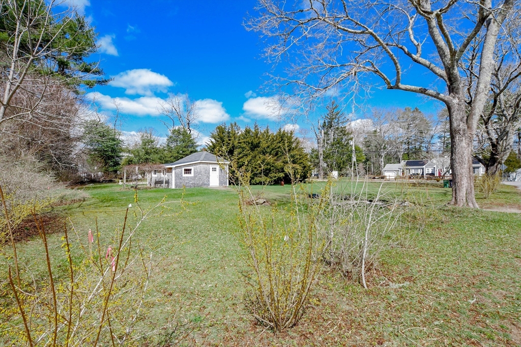 586 B Front Street Marion, MA 02738 - Photo 3 of 10 a view of a golf course with a lake