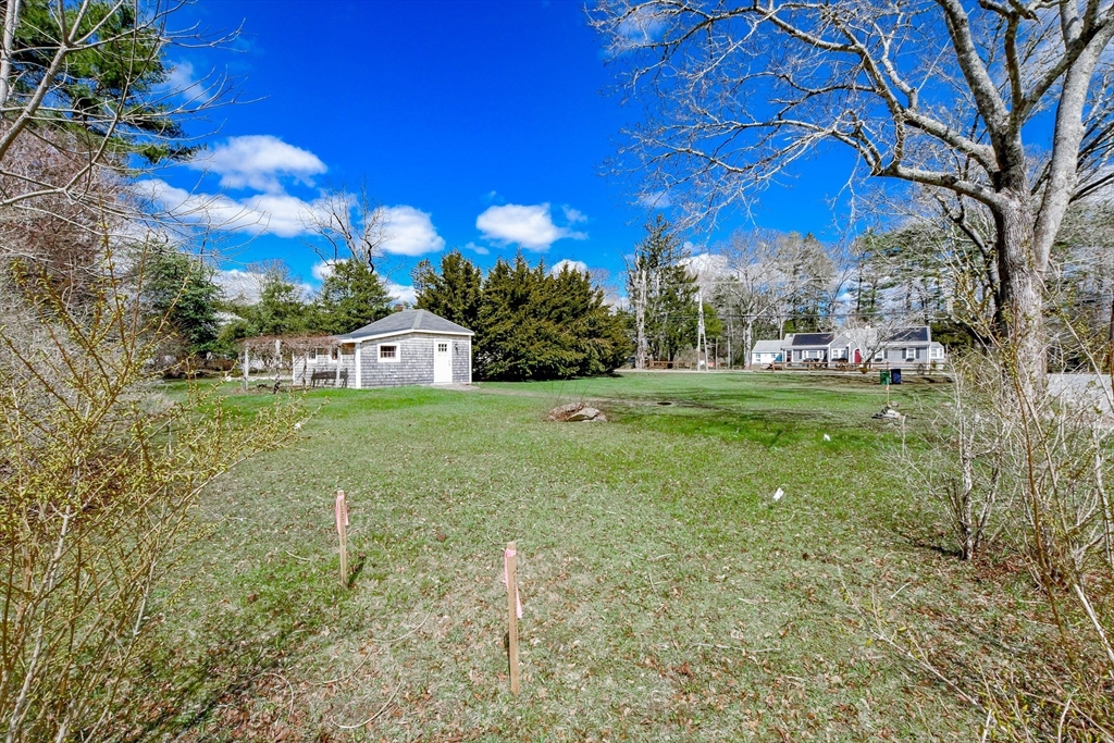 586 B Front Street Marion, MA 02738 - Photo 4 of 10 a view of a white house with a yard