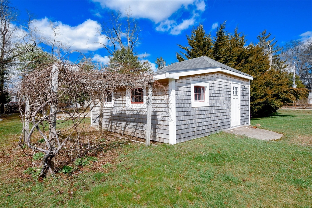 586 B Front Street Marion, MA 02738 - Photo 8 of 10 a view of a house with a yard