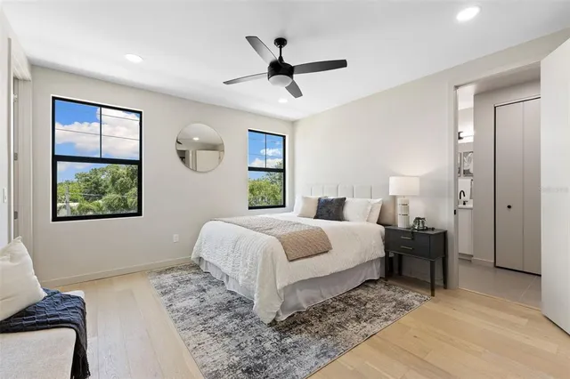 a bedroom with a bed and window