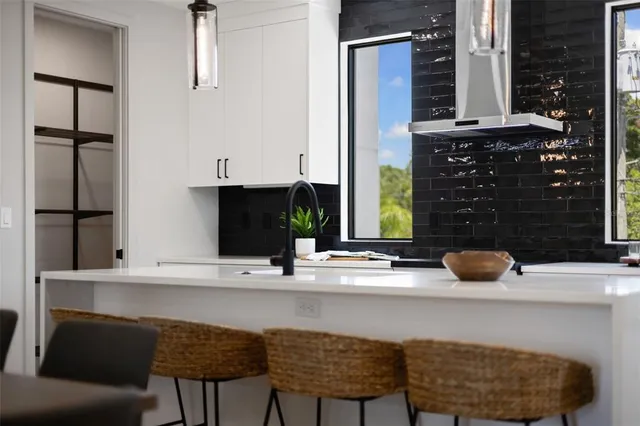 a kitchen with a sink and cabinets