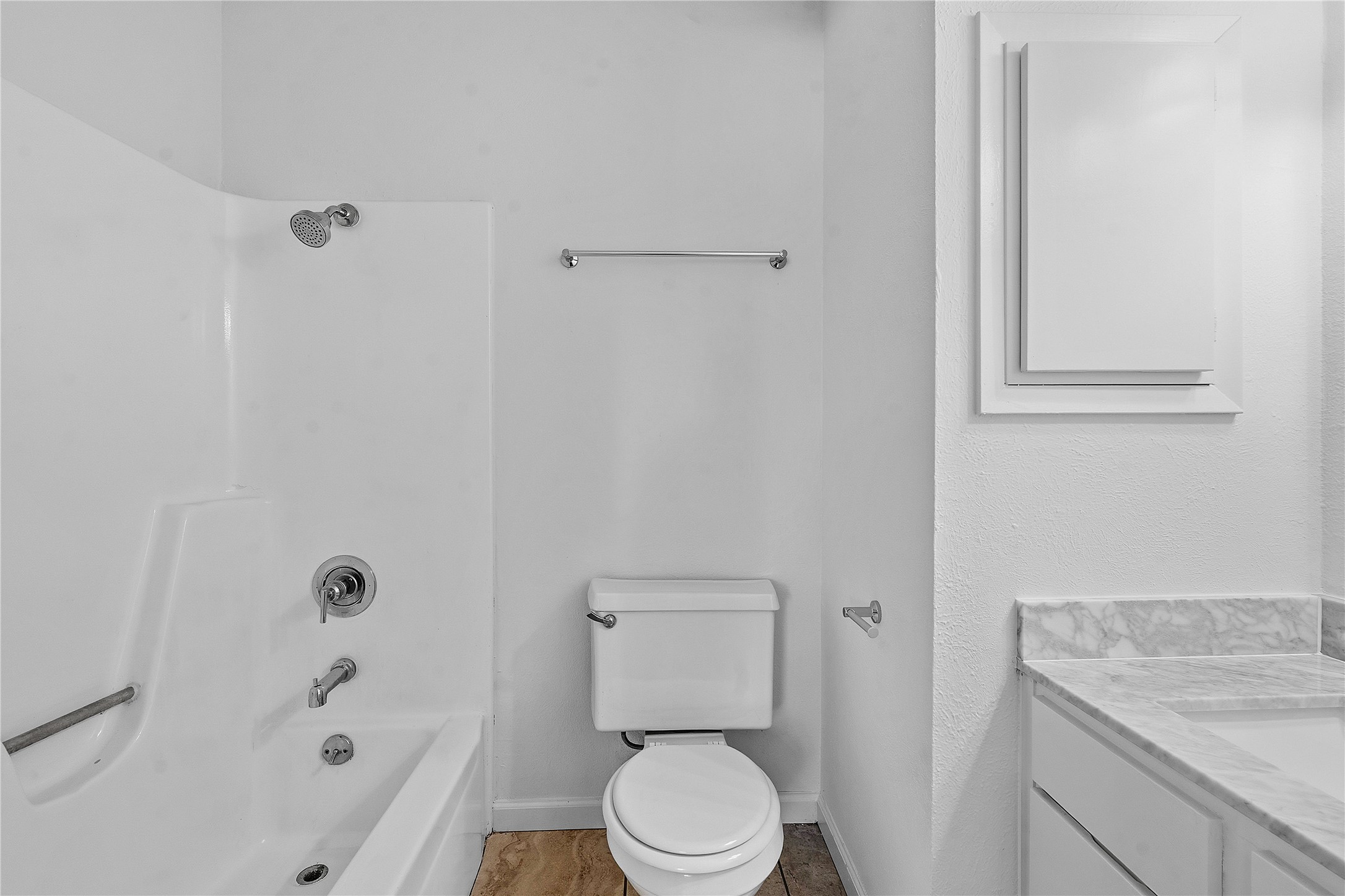 6205 Shadow Bend Austin, TX 78745 - Photo 18 of 31 A well-appointed bath with pristine fixtures and a convenient shower-tub combination.