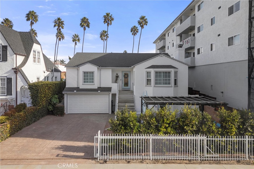 726 1/2 Esplanade Redondo Beach, CA 90277 - Photo 24 of 26 a front view of a house with a garden