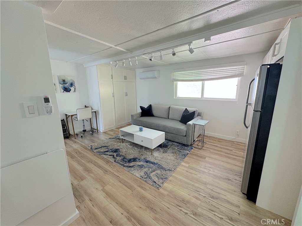 726 1/2 Esplanade Redondo Beach, CA 90277 - Photo 4 of 26 a living room with furniture and a rug